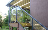 Deck and flat roof with glass balustrade