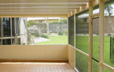 Screen room with insulated dado wall panel and light panels